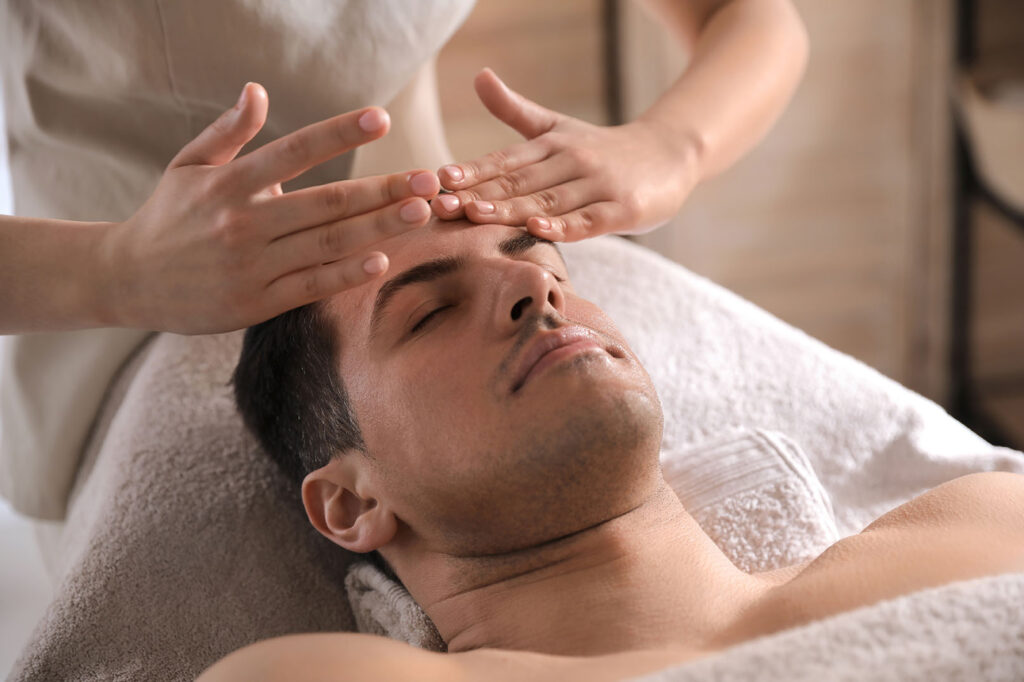 Close-up of a client receiving skin assessment and cleansing before a bespoke facial treatment.